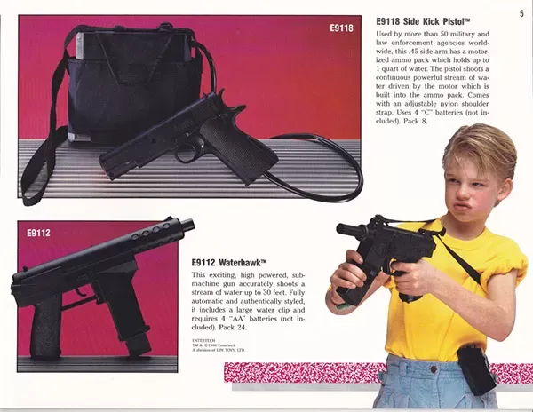 A child holding a gun
Description automatically generated with low confidence